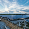 East-West solar ground mounting system with pile foundation installed in utility-scale solar farm